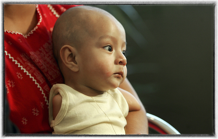 Carlos "Carlitos" Herrera was born without arms or legs because of the misuse of pesticides. : Aftermath sessions : Oklahoma City Editorial and Documentary Photographer 