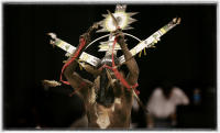 A White Mountain, New Mexico, Apache Crown Dancer dances the scared dance tradition. Mountain Spirits taught the Apaches the dance as a means of healing. 