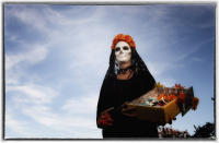 During the holiday, families clean and decorate the graves.
