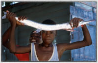 Kids display the day's catch in the Bahamas. 
